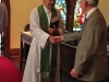 Rev. David Elliott greeting parishioners at St. Georges Episcopal Church in Clarksdale. 