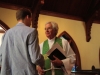 Rev. David Elliott greeting parishioners at St. Georges Episcopal Church in Clarksdale. 