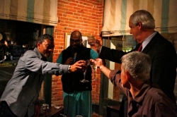 Friends having a toast at now defunct Madidi Restaurant in Clarksdale