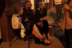 Friends enjoying a party outside Madidi Restaurant in Clarksdale