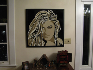 Framed portrait of a woman with long hair.