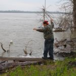 Poor William balancing on a log partially in the Mississippi River in the heart of the Mississippi Delta. Photo by The Delta Bohemian