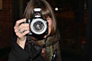 Jill Coursin doing what she loves to do - take photographs. Photo by Delta Bohemian