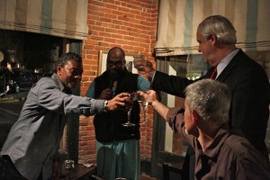 Dr. Alphonso Sanders, Dr. Derrick Miles, Musician Stan Street and Bill Luckett toasting. Photo by Delta Bohemian