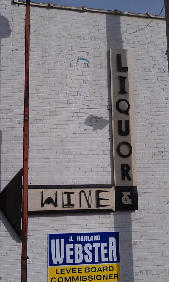 Clarksdale Downtown Wine and Liquor signage on side of building in Clarksdale. Photo and signage by Delta Debris