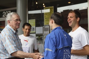 Local Clarksdale retailer Floyd Shankerman greets World Harmony Run torch carriers during their visit to Clarksdale while on the USA 2012 route. Photo by DELTA BOHEMIAN