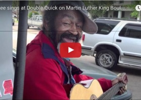 Man singing and playing guitar