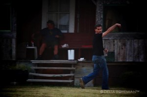 Delta Debris Artist Randall Andrews throwing the pigskin at Shack Up Inn near Clarksdale.