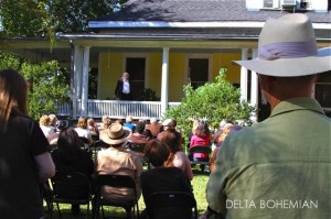 Actor Johnny McPhail performing on a porch during Tennessee Williams Festival in Clarksdale.