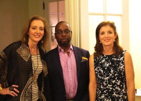 Three people posing for a photo.