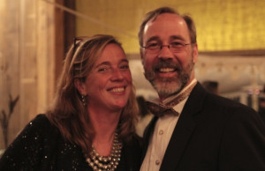 Couple smiling at a formal event.