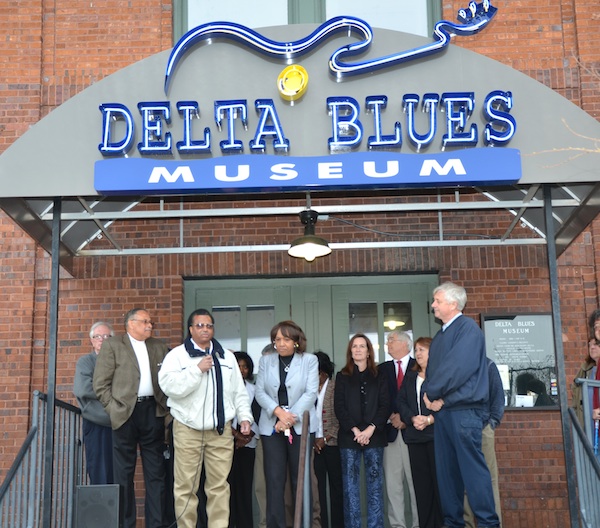 (from left) Wayne Winter, president of the Coahoma County Tourism Commission; Clarksdale Mayor Henry Espy; Coahoma County Supervisor Johnny Newson and his wife, Wilhelmina  Newson; Shelley Ritter, museum director; Bill Gresham , president of the museum’s board of trustees; Kappi Allen, director of Coahoma County Tourism; and Paul Pearson, Coahoma County Supervisor. Photo by Panny Mayfield