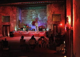 Live music performance in a derelict theater.