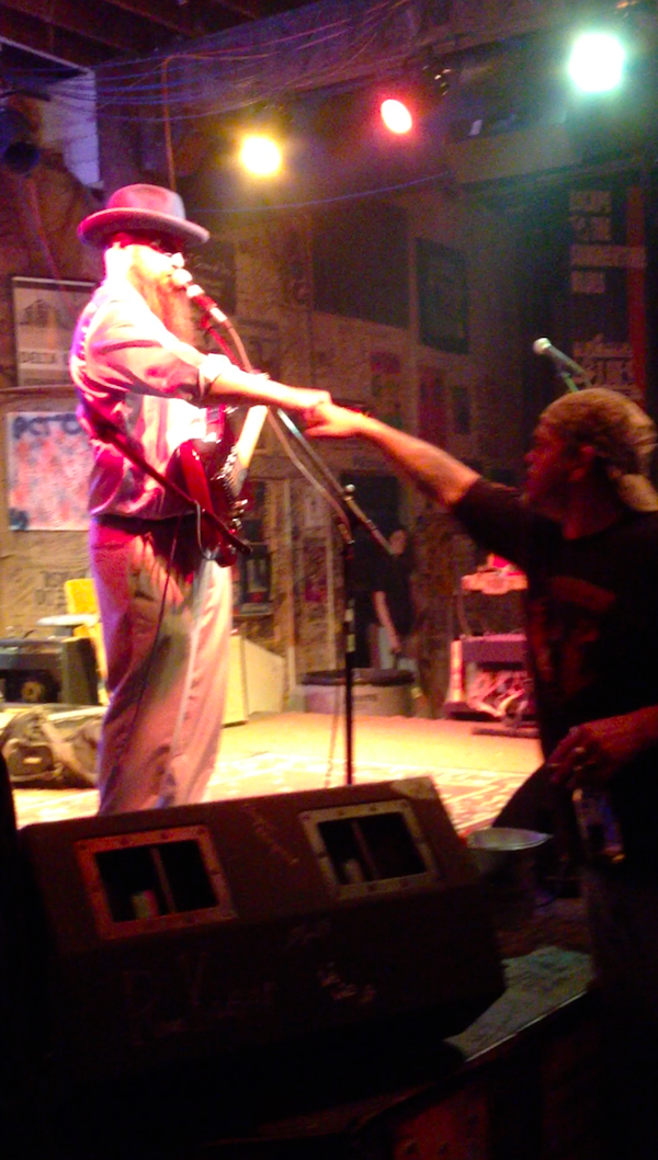 Sean Bad Apple giving a knuckle bump to a visitor at GZBC in Clarksdale.