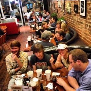 Group of friends enjoying drinks at a restaurant.