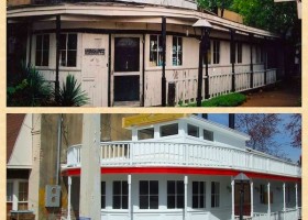 Two white buildings with red trim and railings.