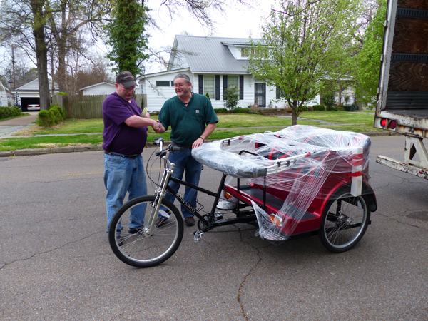 Darrel and Billy shake hands over safe delivery of our pedicab