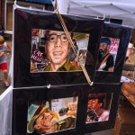 Three framed paintings of men's portraits.