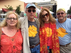 Four friends smiling for a photo.