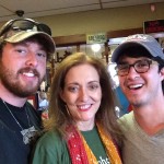 Three people smiling for a photo.