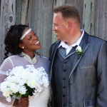 Bride and groom smiling on their wedding day.