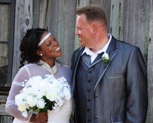 Bride and groom smiling on their wedding day.