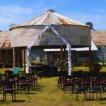 Rustic wedding ceremony at an old barn.