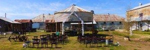 Rustic wedding ceremony at an old barn.