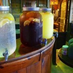 Lemonade, iced tea, and juice in jars.