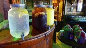 Lemonade, iced tea, and juice in jars.