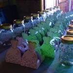 Glass jars with party favors on a table.