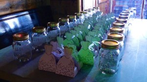 Glass jars with party favors on a table.