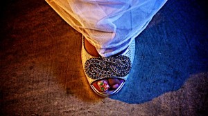 A foot in a jeweled shoe.