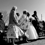 Black and white wedding photo with guests.