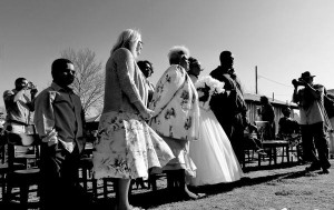 Black and white wedding photo with guests.