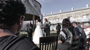 Wedding ceremony with bride and groom outdoors.