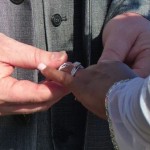 A man and woman exchanging rings.