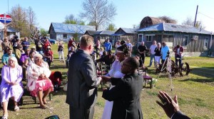 Wedding ceremony with guests and a couple.