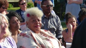 Group of people smiling and looking at camera.