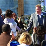 Wedding ceremony with guests and a groom.