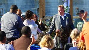 Wedding ceremony with guests and a groom.