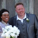 Bride and groom smiling on their wedding day.