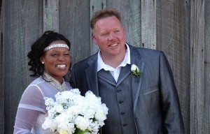 Bride and groom smiling on their wedding day.