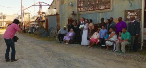 Group photo of people and a photographer.