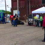 A band plays music at a food stand.