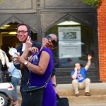 Woman with sunglasses smiles near a man.