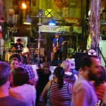 People enjoying live music in a bar.