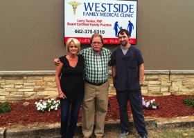 Dr. Larry Tucker with Receptionist Debbie Lee and LPN Jarred Jenkins in front of the Westside Family Medical Clinic