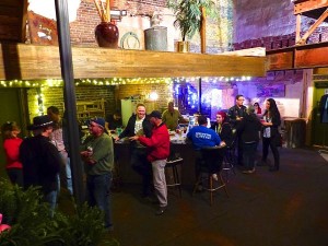 Group of people at a bar inside a building.