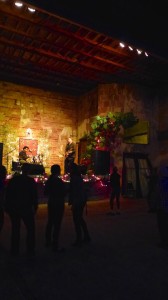 Live music performance in a brick building.